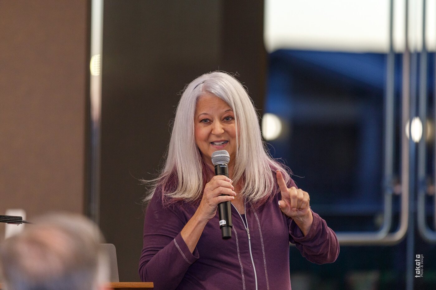 Sue Brooke speaking on stage